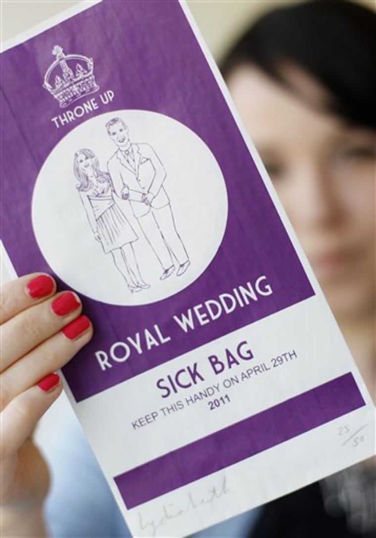 Ellie Phillips, of London's Jealous Gallery, holds up a specially commissioned airline style sick bag for people who have had too much of the Royal Wedding between Prince William and Kate Middleton.